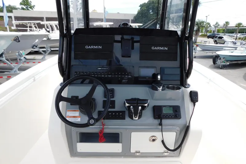 Slide: The Image of 2021 Cobia 262 Center Console boat dashboard with Garmin navigation system. - 10