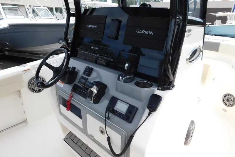 Slide: The Image of 2021 Cobia 262 Center Console boat dashboard with Garmin navigation system. - 11