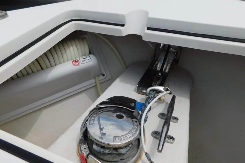 Slide: The Image of Anchor locker of 2021 Cobia 262 Center Console boat with winch and cleat. - 18