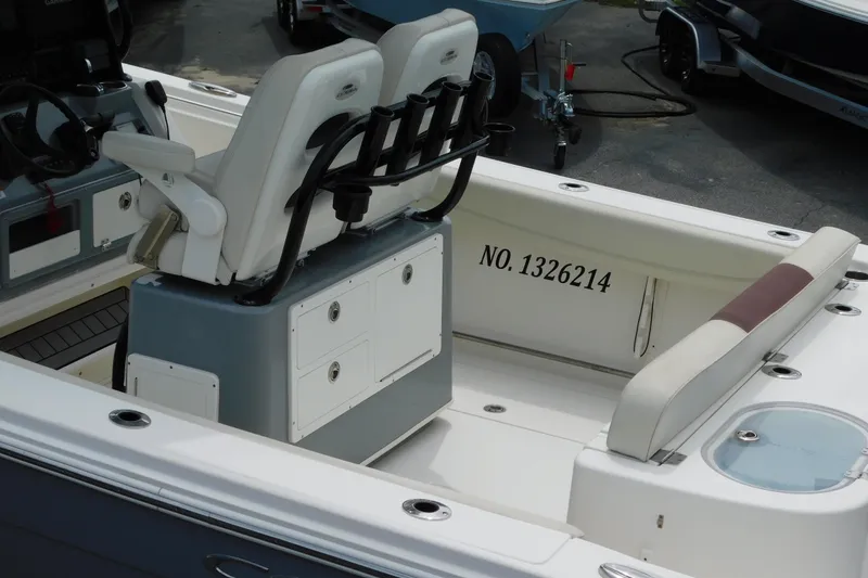 Slide: The Image of 2021 Cobia 262 Center Console boat interior with seating and storage compartments. - 24