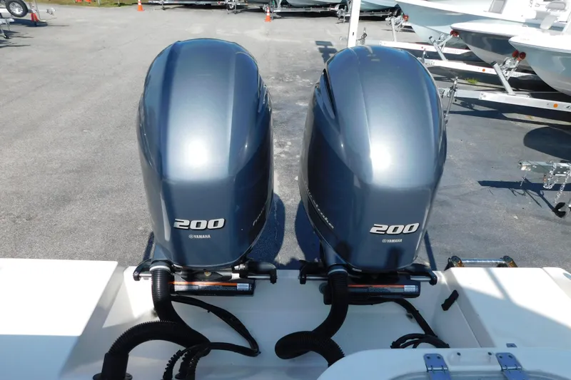 Slide: The Image of Twin Yamaha 200 engines on a 2021 Cobia 262 Center Console boat. - 25
