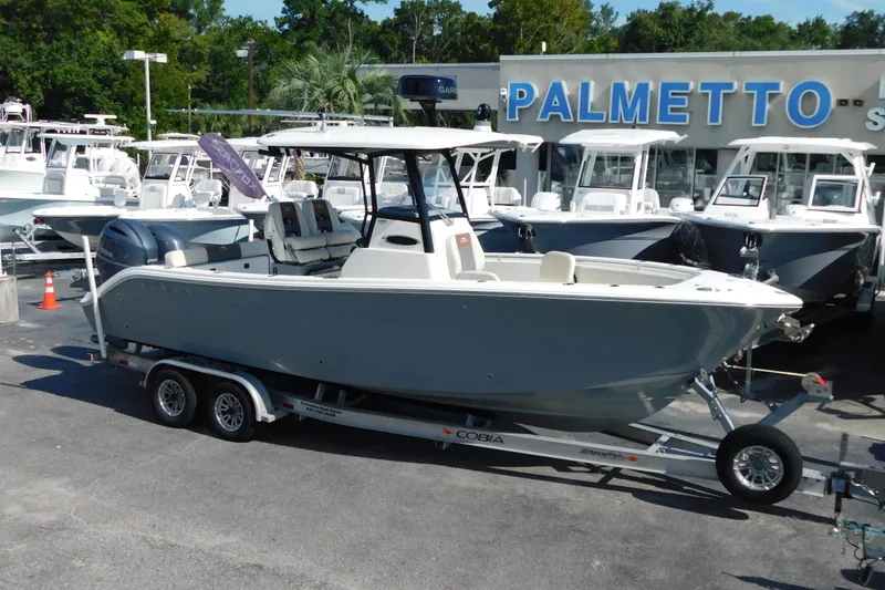 Slide: The Image of 2021 Cobia 262 Center Console boat on trailer at dealership. - 3