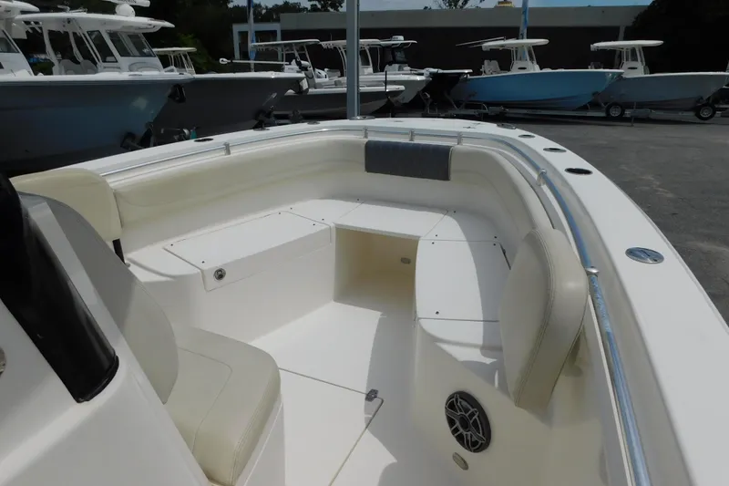 Slide: The Image of 2021 Cobia 262 Center Console boat interior with seating and storage compartments. - 33