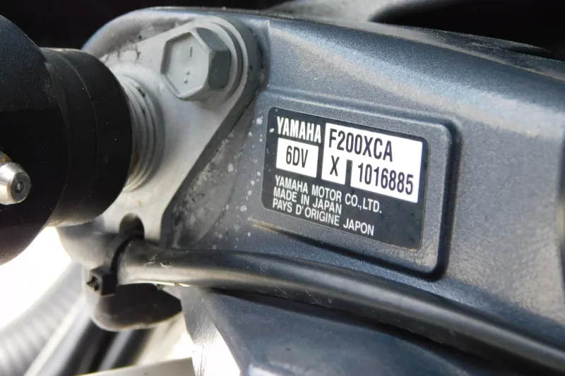Slide: The Image of Yamaha F200XCA engine label on 2021 Cobia 262 Center Console boat. - 47