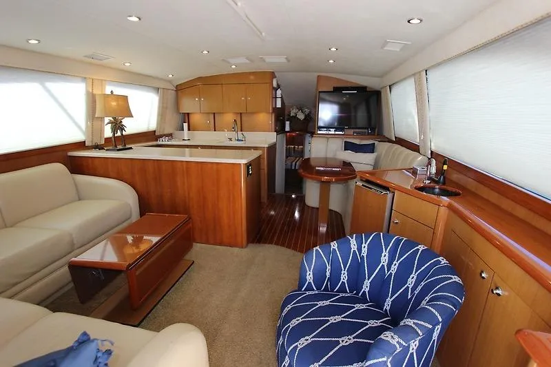 Slide: The Image of Luxurious interior of a 2002 Ocean Yachts model, featuring elegant seating and modern amenities. - 6