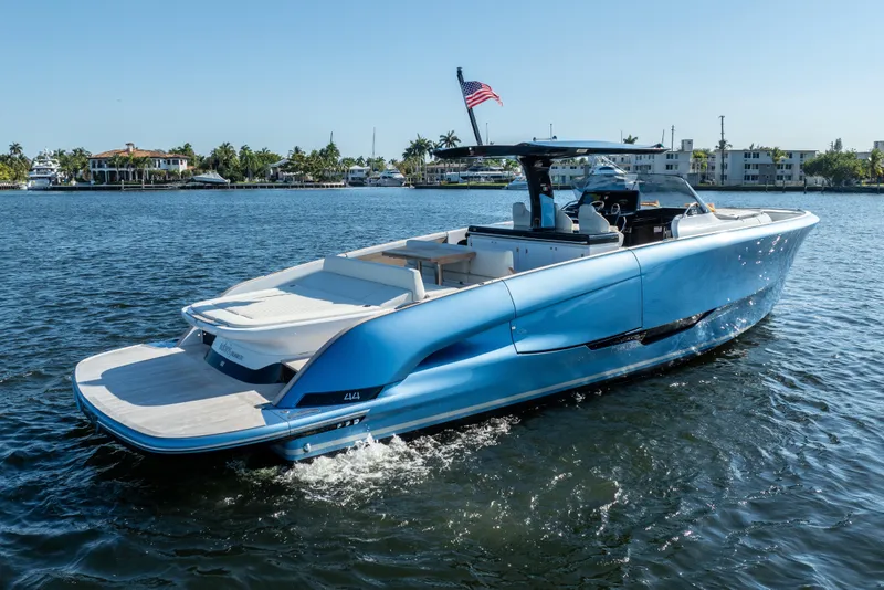 Slide: The Image of 2025 Solaris Power 44 Open yacht cruising on a sunny day, showcasing sleek design. - 2