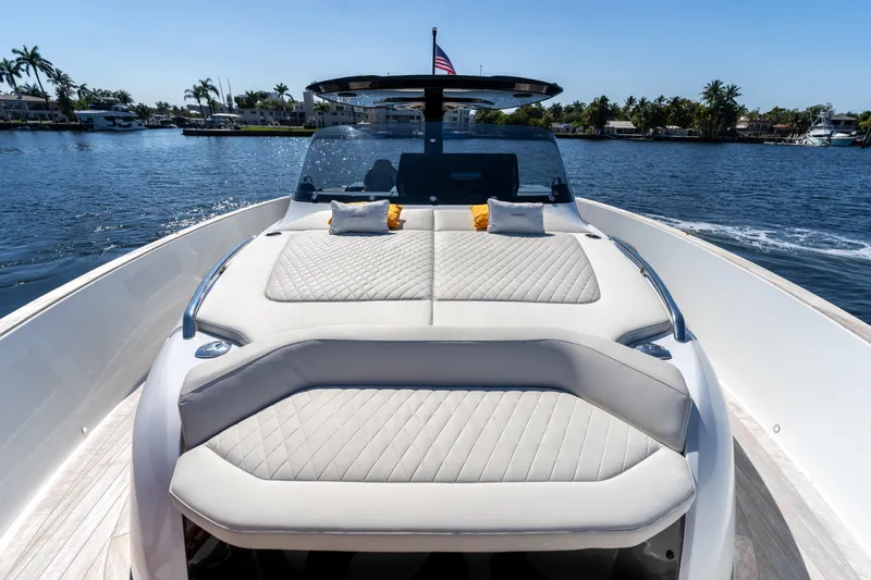 Slide: The Image of 2025 Solaris Power 44 Open yacht with luxurious sunbathing area on a serene waterway. - 27