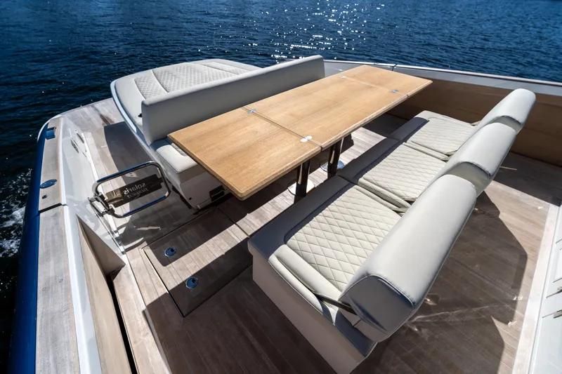 Slide: The Image of Luxurious seating area on 2025 Solaris Power 44 Open yacht, featuring elegant wood table. - 35