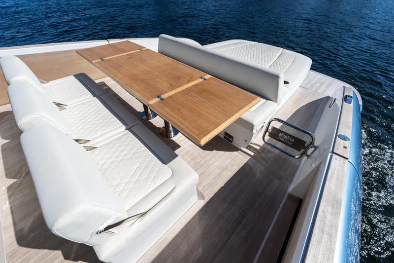 Slide: The Image of Luxurious seating area on 2025 Solaris Power 44 Open yacht with wooden table. - 37