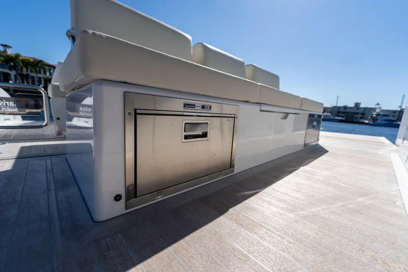 Slide: The Image of 2025 Solaris Power 44 Open yacht interior with sleek seating and built-in storage. - 41