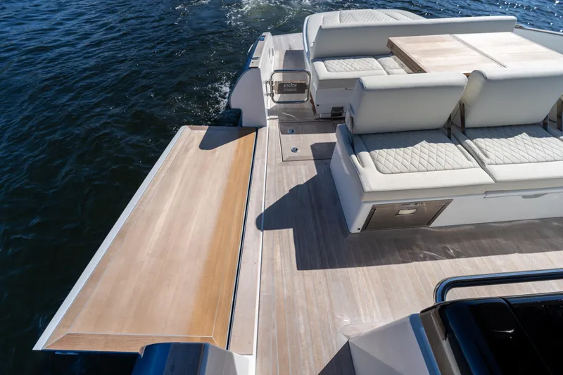 Slide: The Image of 2025 Solaris Power 44 Open yacht with luxurious seating and extended deck on the water. - 42