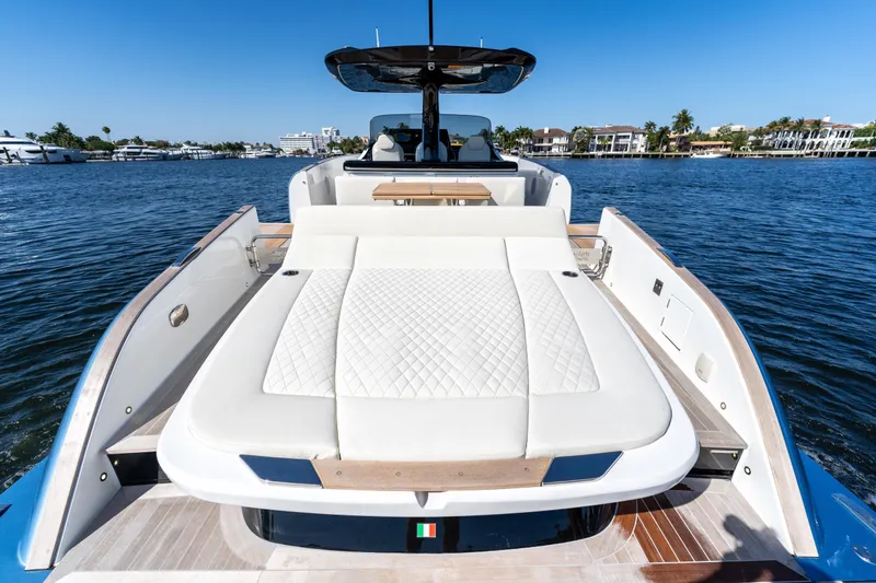 Slide: The Image of 2025 Solaris Power 44 Open yacht with luxurious sunbed on calm water. - 44