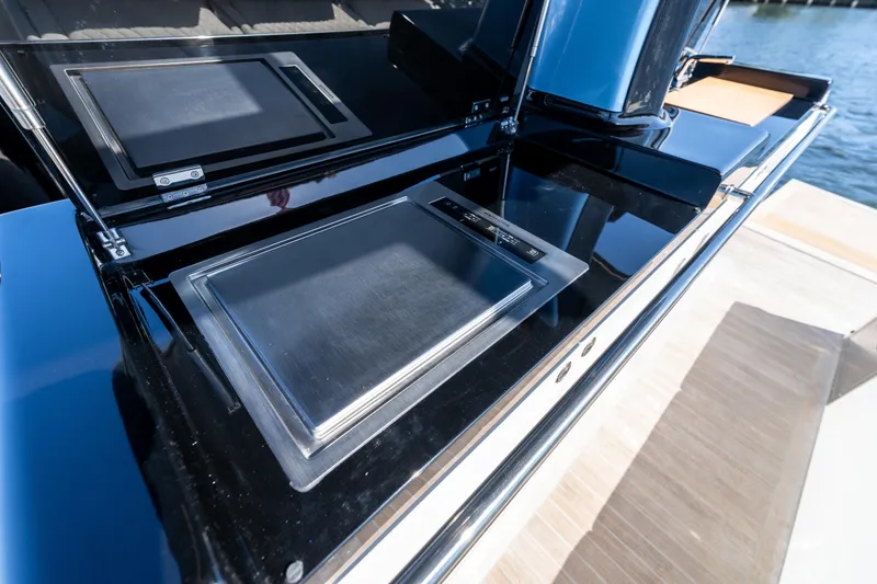Slide: The Image of Outdoor kitchen area on 2025 Solaris Power 44 Open yacht, featuring sleek stainless steel appliances. - 49