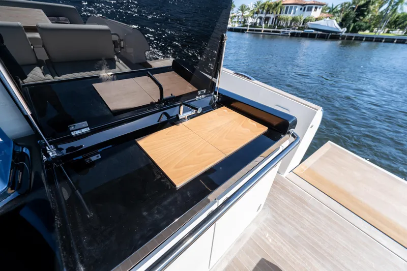 Slide: The Image of 2025 Solaris Power 44 Open yacht with sleek outdoor kitchen by the water. - 50