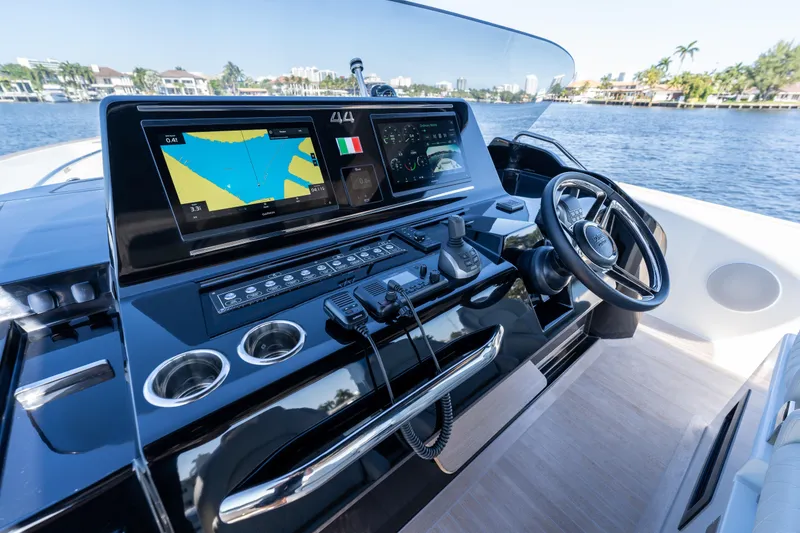 Slide: The Image of Helm of 2025 Solaris Power 44 Open yacht with advanced navigation displays. - 54