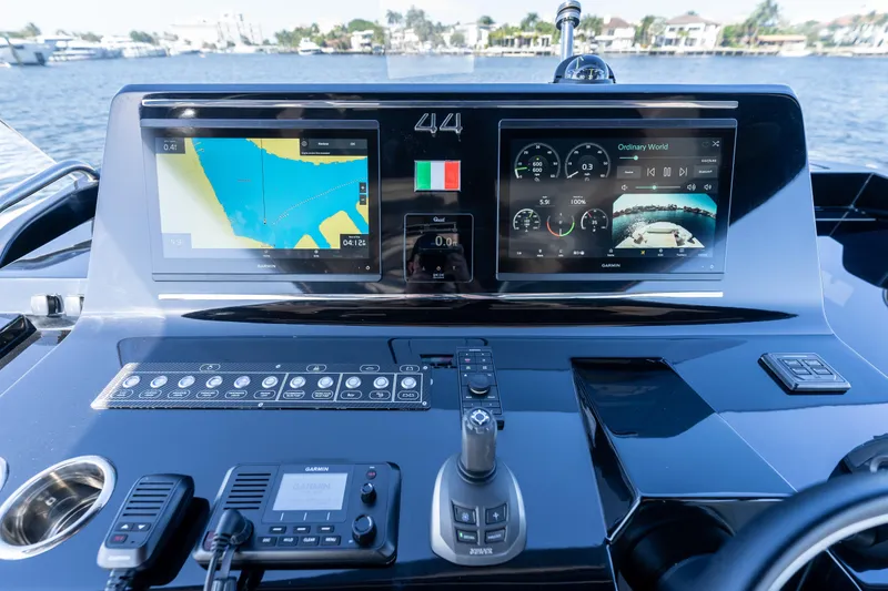 Slide: The Image of Control panel of 2025 Solaris Power 44 Open yacht with navigation screens and controls. - 57