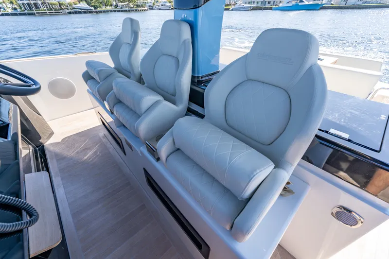 Slide: The Image of Luxurious seating on 2025 Solaris Power 44 Open yacht, overlooking serene waters. - 62