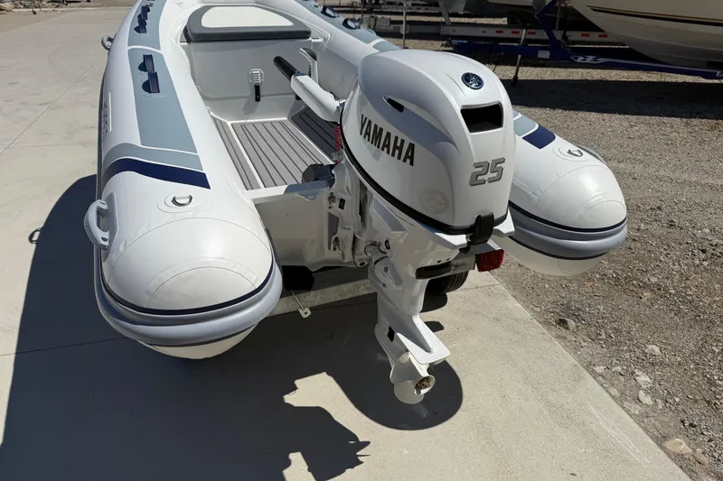 Slide: The Image of 2024 Highfield Classic 340 boat with Yamaha 25 outboard motor, docked on concrete. - 5