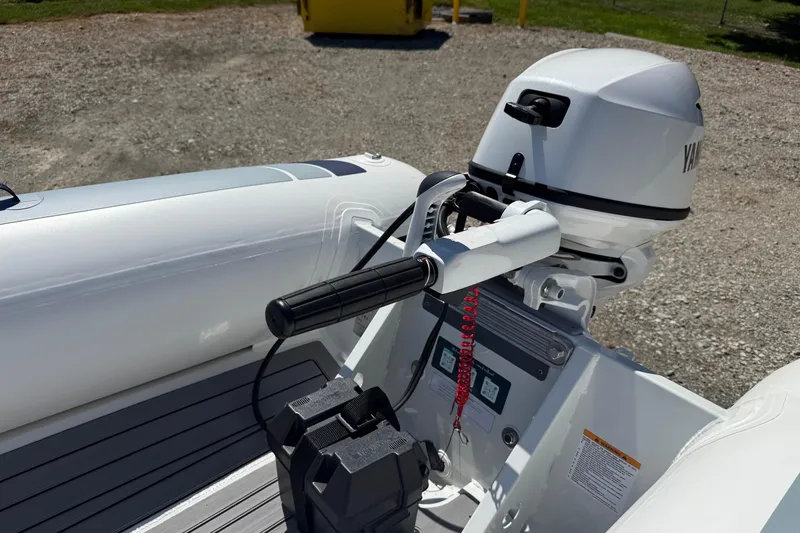 Slide: The Image of 2024 Highfield Classic 340 boat with Yamaha outboard motor, featuring sleek design and modern controls. - 6