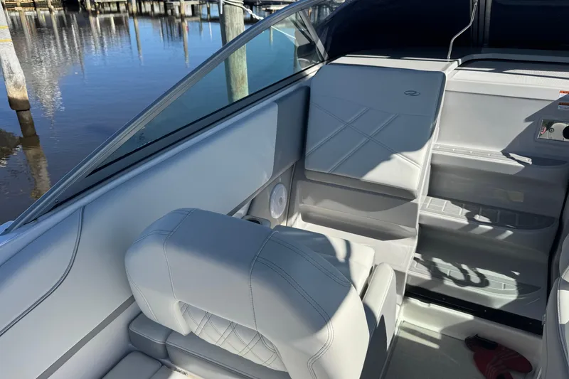 Slide: The Image of 2024 Regal 26 XO boat interior with sleek seating and modern design. - 11