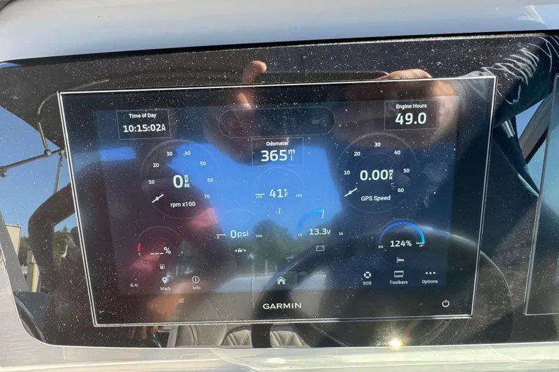 Slide: The Image of Garmin display on 2024 Regal 26 XO boat showing odometer and engine data. - 24