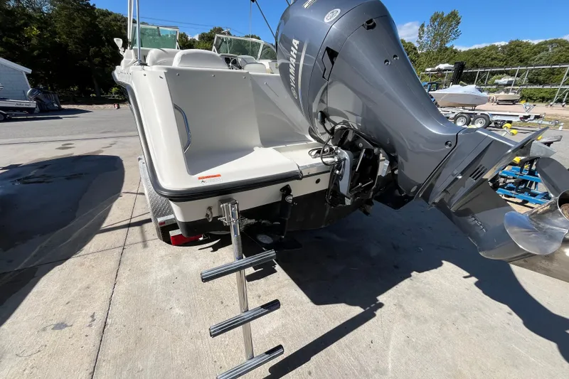 Slide: The Image of 2006 Hydra-Sports Lightning 202 DC boat with Yamaha outboard motor and boarding ladder. - 10