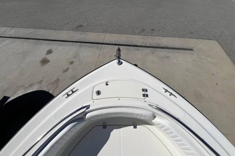 Slide: The Image of 2006 Hydra-Sports Lightning 202 DC boat bow view on concrete surface. - 11