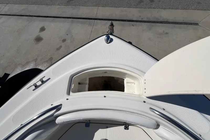 Slide: The Image of 2006 Hydra-Sports Lightning 202 DC boat bow with open storage compartment. - 12