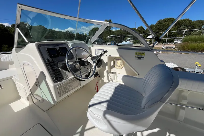 Slide: The Image of 2006 Hydra-Sports Lightning 202 DC boat interior with steering wheel and seating. - 17