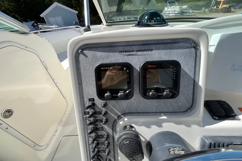 Slide: The Image of 2006 Hydra-Sports Lightning 202 DC dashboard with speed and tachometer gauges. - 18