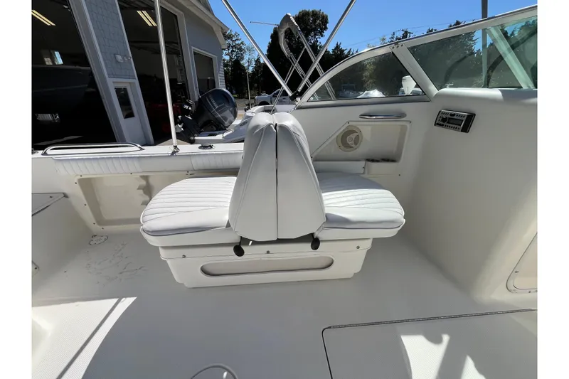 Slide: The Image of 2006 Hydra-Sports Lightning 202 DC boat interior with white seating and dashboard. - 21