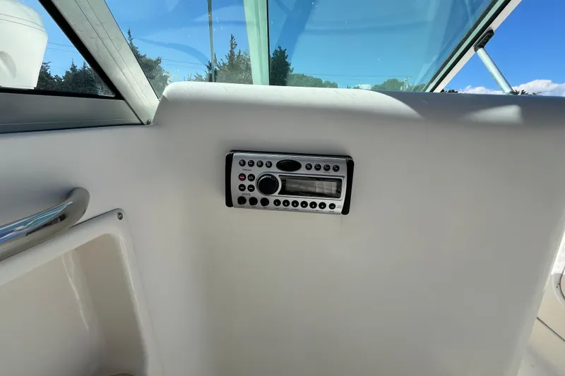 Slide: The Image of 2006 Hydra-Sports Lightning 202 DC boat interior with stereo system and window view. - 22