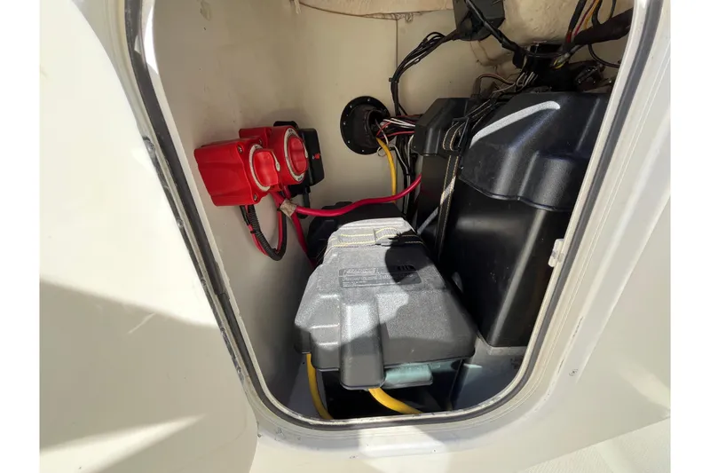 Slide: The Image of 2006 Hydra-Sports Lightning 202 DC battery compartment with wiring and components. - 25