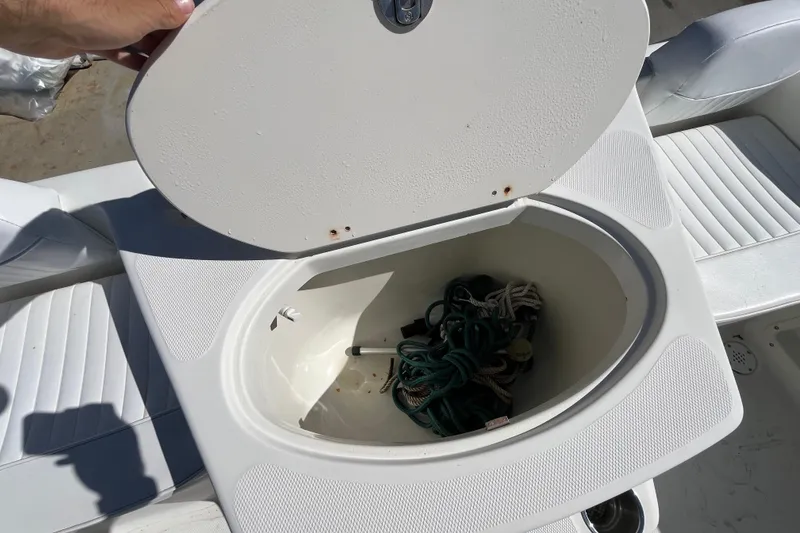 Slide: The Image of Open storage compartment on 2006 Hydra-Sports Lightning 202 DC boat, containing ropes. - 29