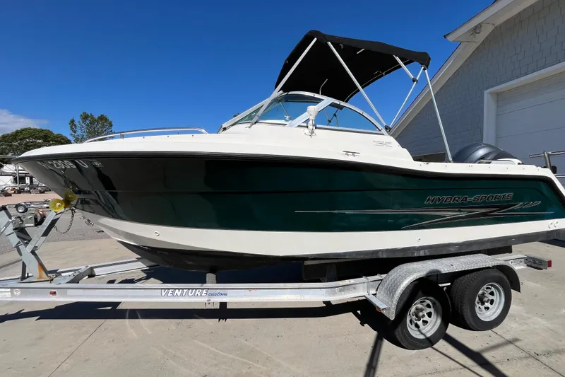Slide: The Image of 2006 Hydra-Sports Lightning 202 DC boat on trailer, parked outdoors under clear blue sky. - 3