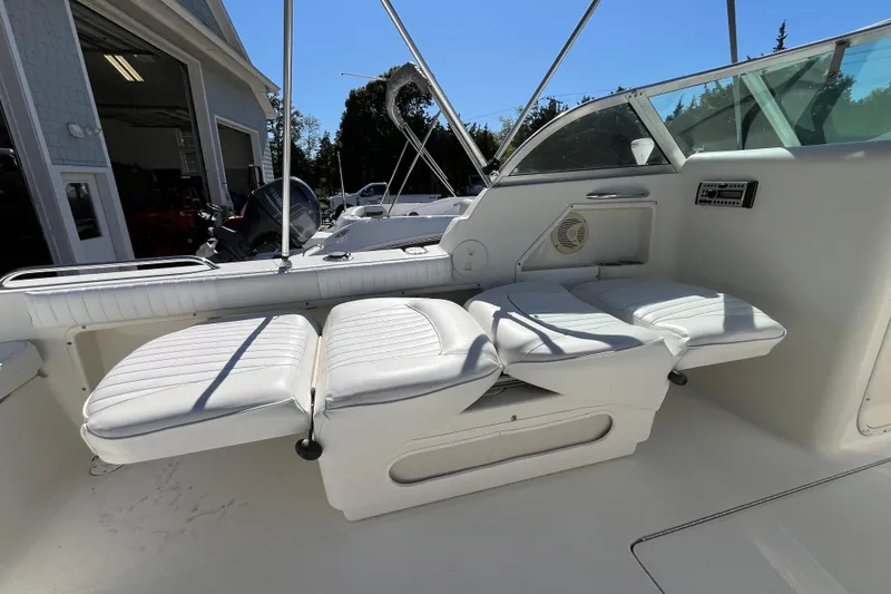 Slide: The Image of 2006 Hydra-Sports Lightning 202 DC boat interior with white cushioned seating. - 30