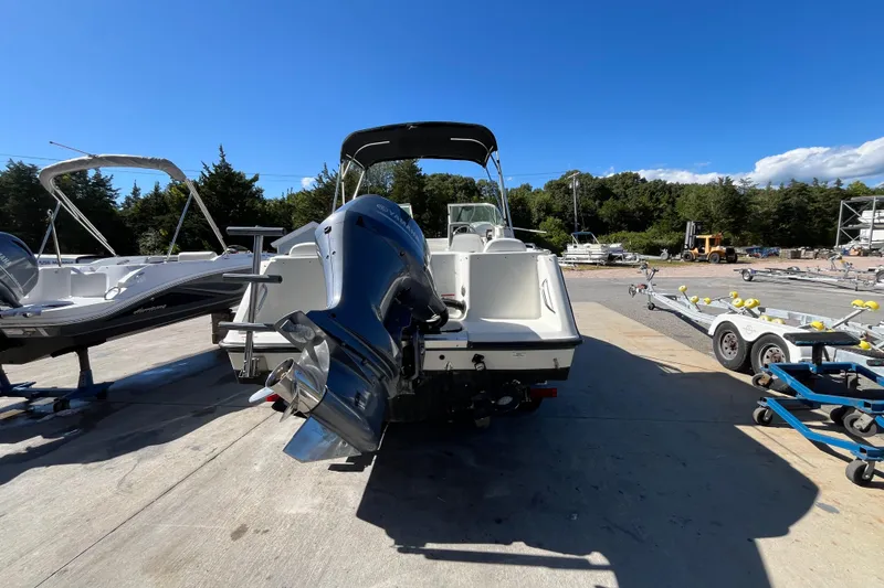 Slide: The Image of 2006 Hydra-Sports Lightning 202 DC boat with outboard motor, parked on a sunny day. - 32