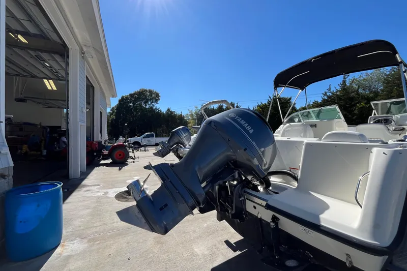 Slide: The Image of 2006 Hydra-Sports Lightning 202 DC boat with Yamaha outboard motor in a sunny marina. - 8