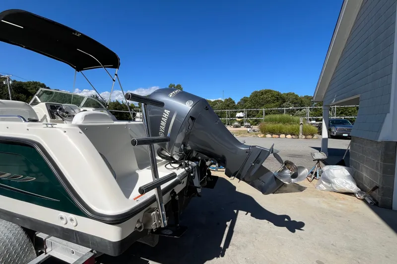 Slide: The Image of 2006 Hydra-Sports Lightning 202 DC boat with Yamaha outboard motor, parked outdoors. - 9