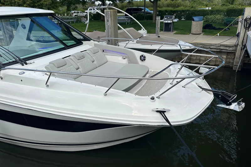 Slide: The Image of 2021 Sea Ray Sundancer 320 Coupe Outboard docked, featuring sleek design and comfortable seating. - 24