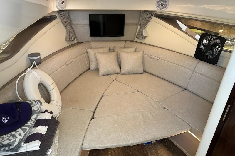 Slide: The Image of Interior of 2021 Sea Ray Sundancer 320 Coupe Outboard with cozy seating and modern amenities. - 26