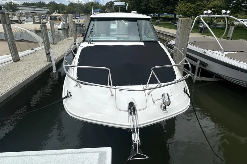 Slide: The Image of 2021 Sea Ray Sundancer 320 Coupe Outboard docked at marina. - 3