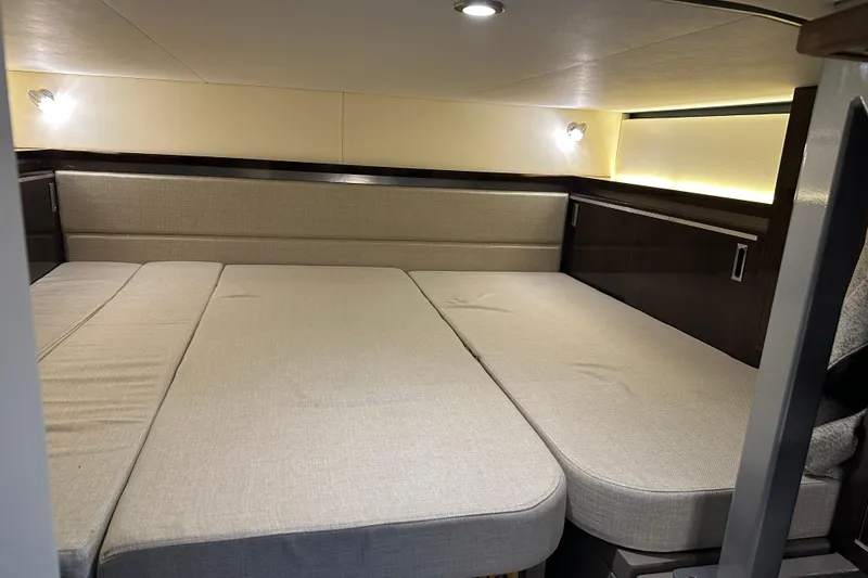 Slide: The Image of Interior cabin of 2021 Sea Ray Sundancer 320 Coupe Outboard, featuring a spacious bed. - 30