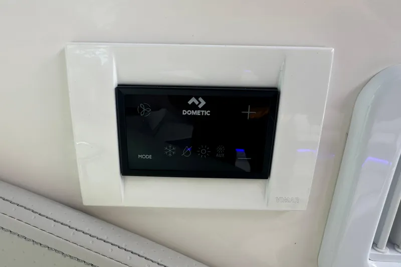 Slide: The Image of Dometic control panel on 2021 Sea Ray Sundancer 320 Coupe Outboard boat interior. - 33