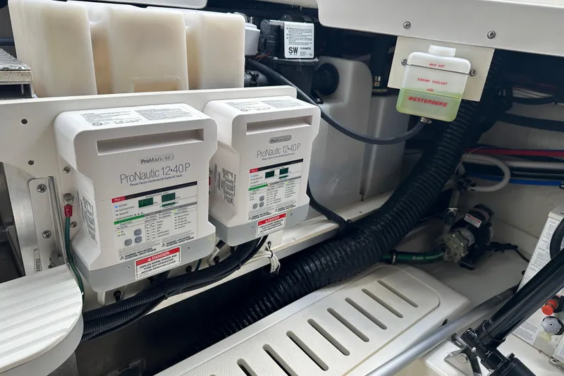 Slide: The Image of Engine compartment of 2021 Sea Ray Sundancer 320 Coupe Outboard with ProNautic chargers. - 39