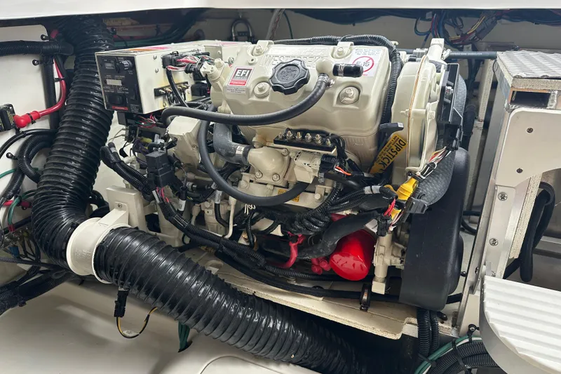 Slide: The Image of Engine compartment of a 2021 Sea Ray Sundancer 320 Coupe Outboard, showcasing detailed wiring and components. - 40
