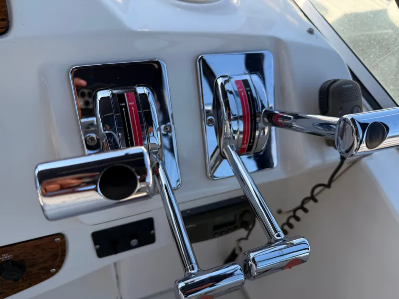 Slide: The Image of Chrome throttle controls on a 2002 Bayliner 3488 Motoryacht dashboard. - 14