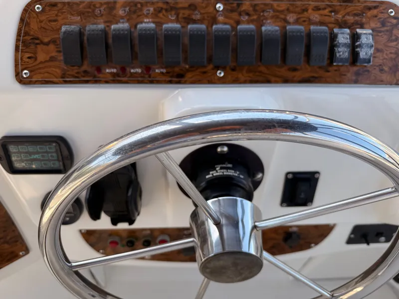 Slide: The Image of Steering wheel and control panel of 2002 Bayliner 3488 Motoryacht. - 15