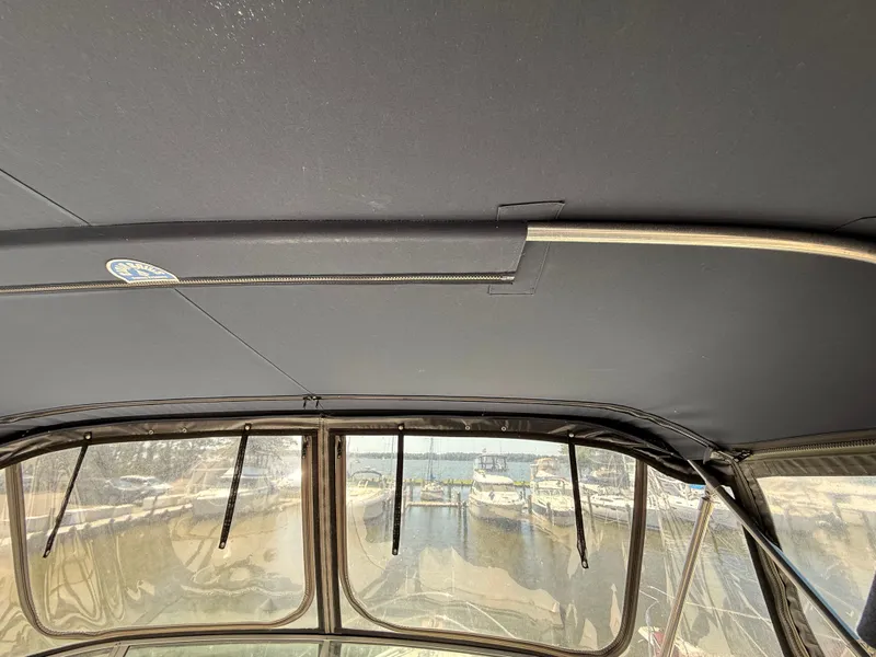 Slide: The Image of 2002 Bayliner 3488 Motoryacht interior view with marina background. - 17