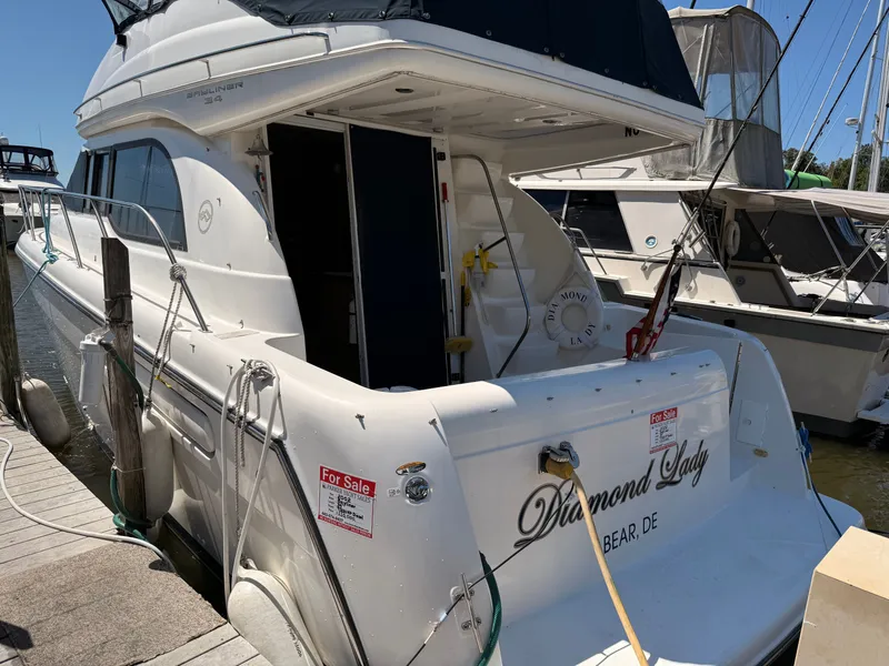 Slide: The Image of 2002 Bayliner 3488 Motoryacht "Diamond Lady" docked, for sale sign visible. - 2